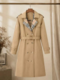 New autumn women’s loose long coat featuring a double-breasted design, khaki trench style, notched lapel with plaid lining, and an adjustable waist belt that cinches the silhouette—an essential piece for spring and autumn outfits.sohochic sohochic...
