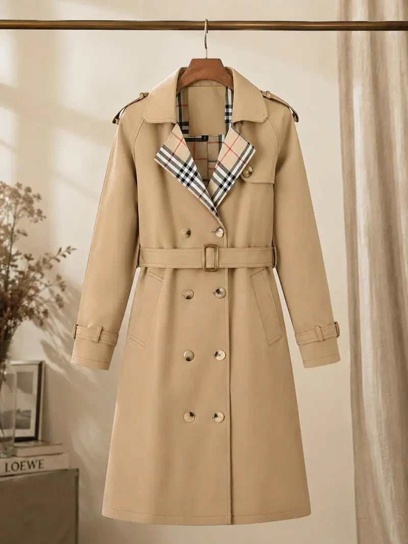 New autumn women’s loose long coat featuring a double-breasted design, khaki trench style, notched lapel with plaid lining, and an adjustable waist belt that cinches the silhouette—an essential piece for spring and autumn outfits.sohochic sohochic...