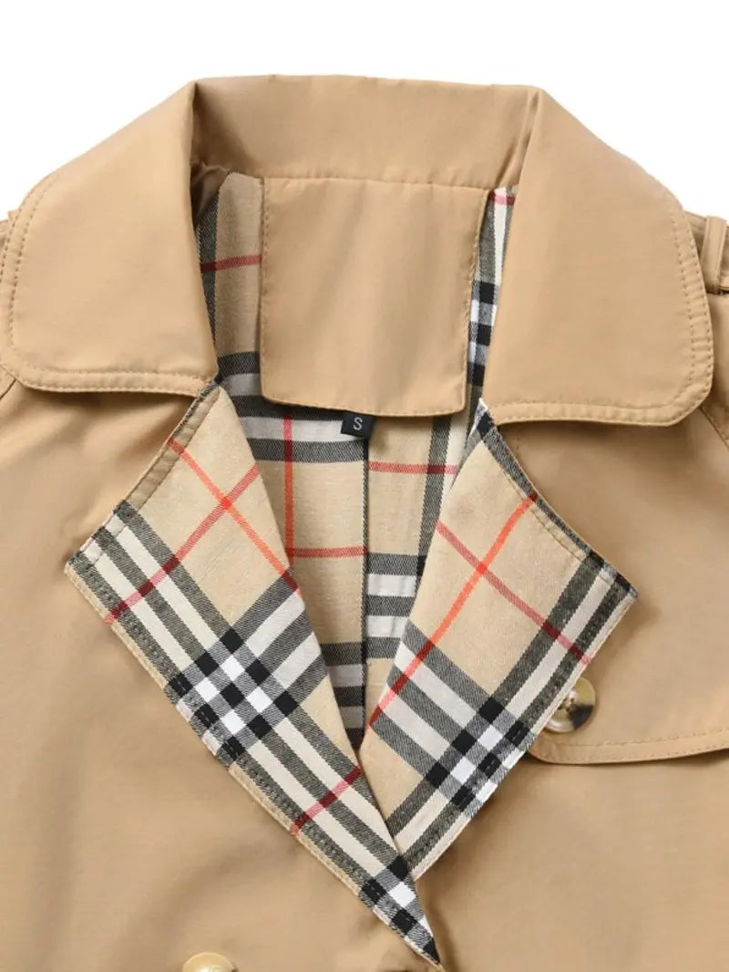 New autumn women’s loose long coat featuring a double-breasted design, khaki trench style, notched lapel with plaid lining, and an adjustable waist belt that cinches the silhouette—an essential piece for spring and autumn outfits.sohochic sohochic...