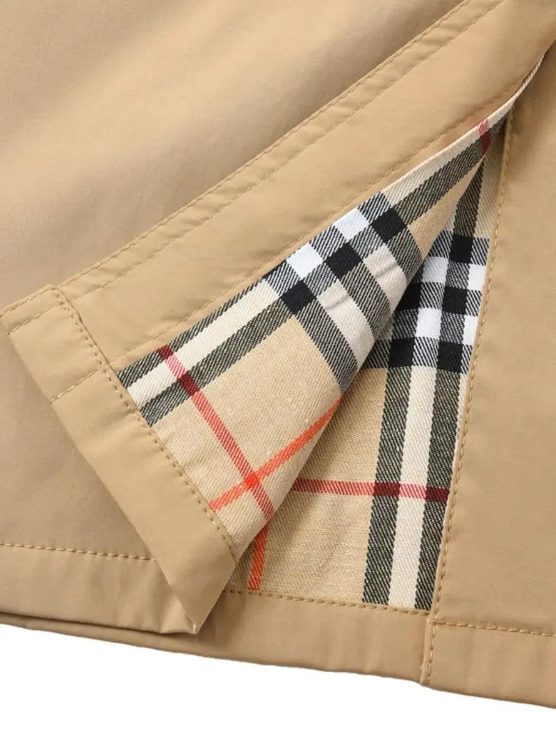 New autumn women’s loose long coat featuring a double-breasted design, khaki trench style, notched lapel with plaid lining, and an adjustable waist belt that cinches the silhouette—an essential piece for spring and autumn outfits.sohochic sohochic...